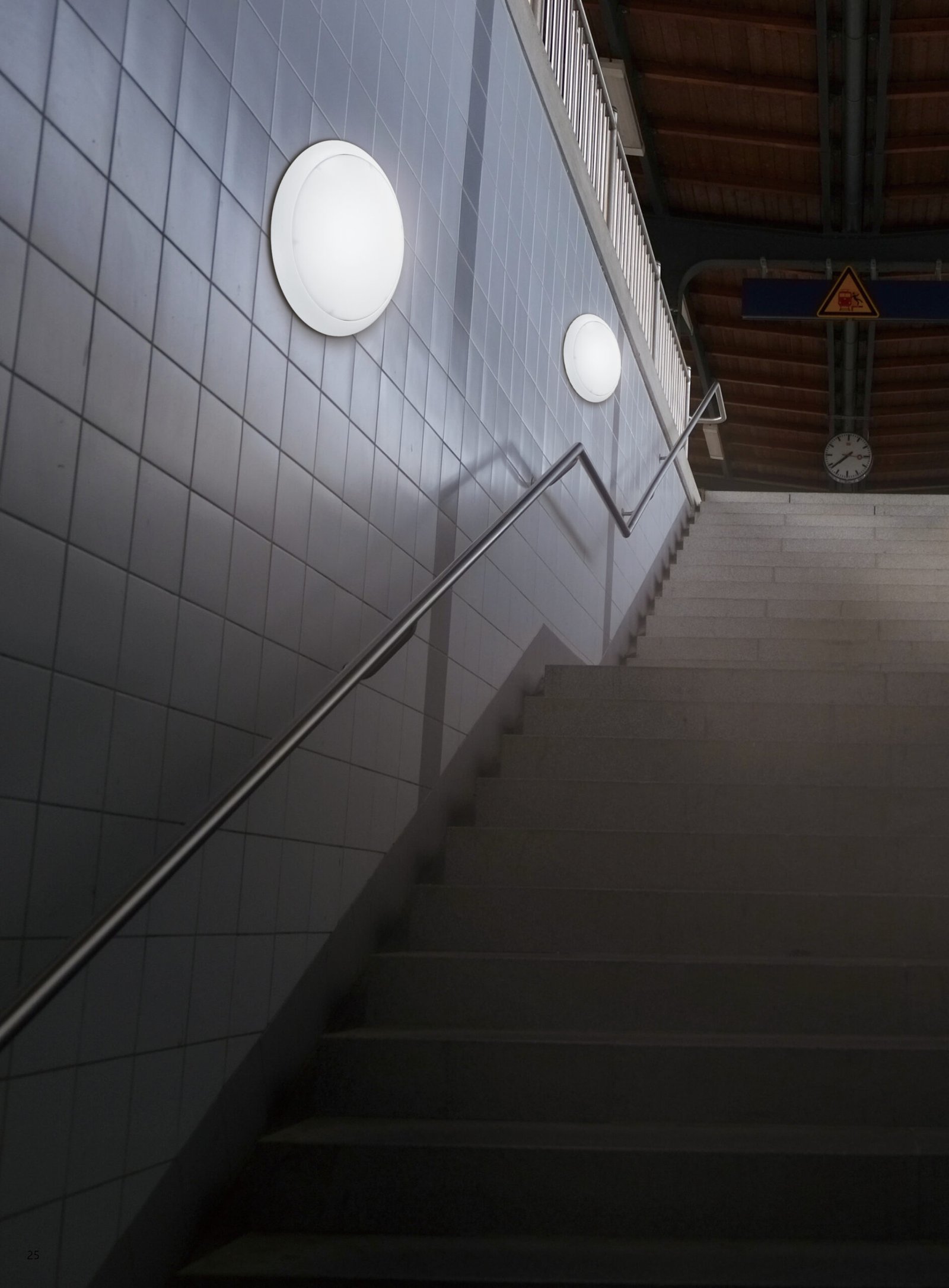 LED bulkhead light installed in public transit staircase – durable IP65 wall light for tunnels, subways, and stairwells