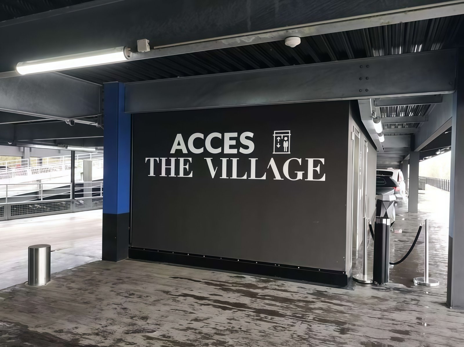 Tri-Proof Tubular LED light installed in a parking garage in France Lyon The Village — industrial waterproof LED tube lighting for commercial and architectural projects.