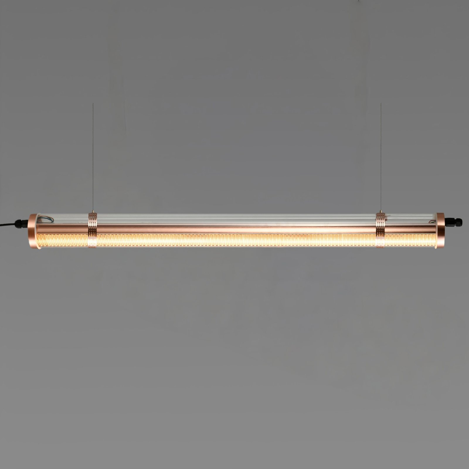 Titan Architectural Tubular Luminaire Titan architectural tubular luminaire with integrated honeycomb optic, suspended installation, warm brass-toned metal finish