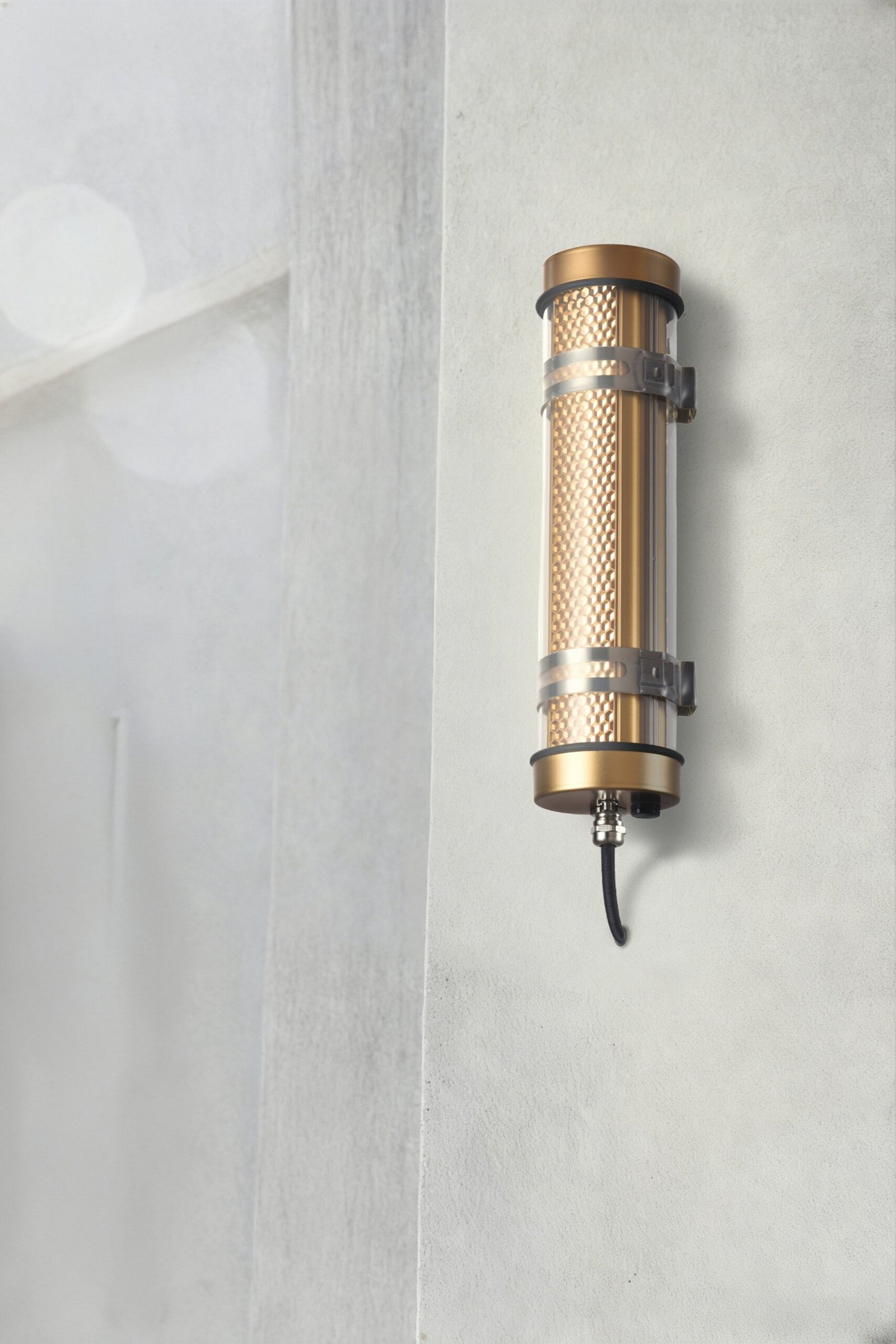 Arno Architectural Tubular Luminaire Arno IP67 IK10 architectural tubular wall lights installed on an outdoor building façade for long-term weather-resistant lighting