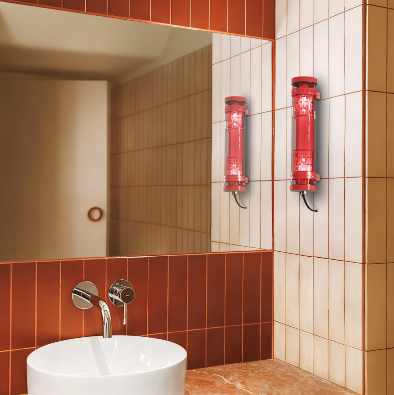 Moreau decorative tubular wall lights installed in a bathroom interior, featuring red metal grille and E27 lamp system for architectural wall lighting