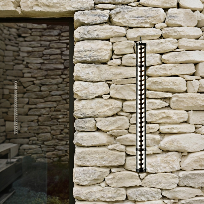 Corbusier Architectural Tubular Luminaire Corbusier architectural tubular wall light with aluminum louvre optics installed on stone façade, IP67 outdoor lighting application